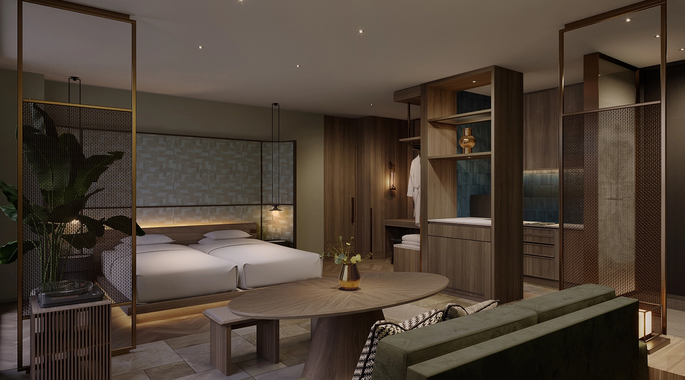 Suite Room：間接照明の柔らかな光に包まれた、洗練された和モダンの客室。手前のグリーンのソファーや木製テーブルから、奥の心地よさそうなツインベッドまでが美しく調和する内観。