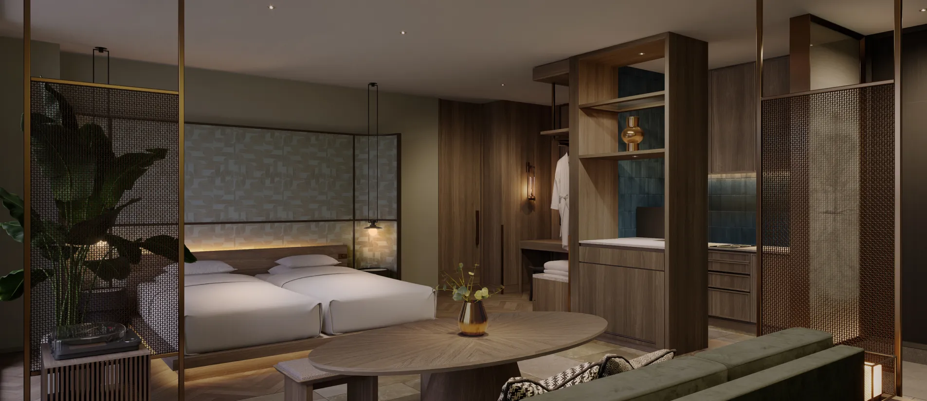 Guest room featuring twin beds with crisp white bedding behind a wood partition, alongside an oval dining table.