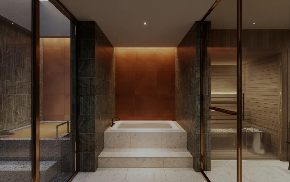 Private spa bathed in warm orange backlight, featuring a raised square cold bath, open-air hot spring bath, and sauna arranged side by side.